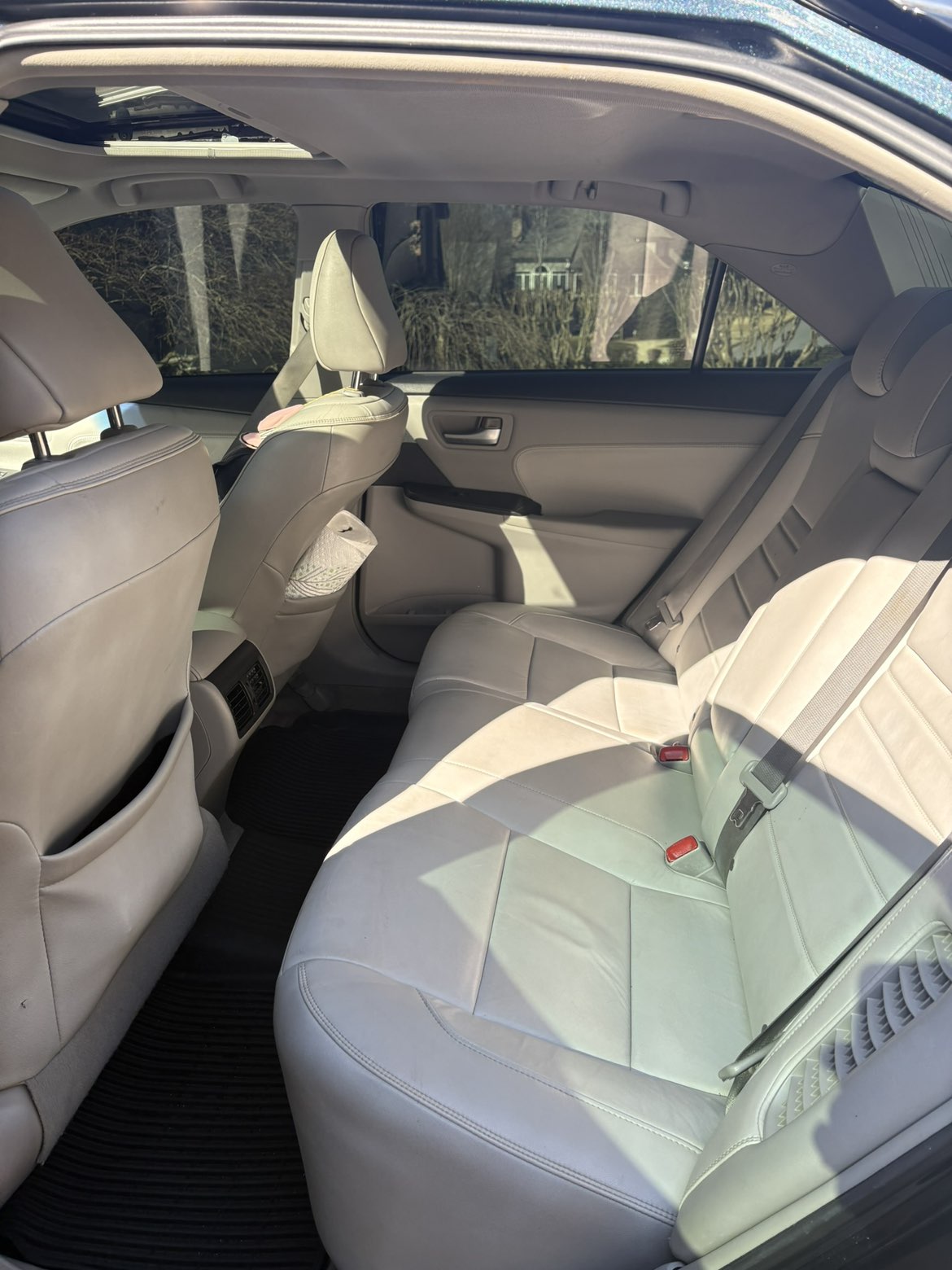 Deep interior detailing of rear seating area with spotless upholstery by Countryside Auto Detailing serving Buckhead